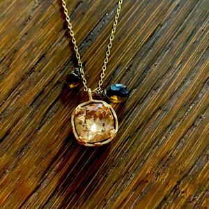 Citrine colored pendant with amber beads/gold colored necklace